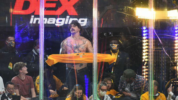 Tennessee Titans offensive lineman Taylor Lewan hypes the crowd during the second period in game four of the first round of the 2021 Stanley Cup Playoffs between the Nashville Predators and the Carolina Hurricanes at Bridgestone Arena.